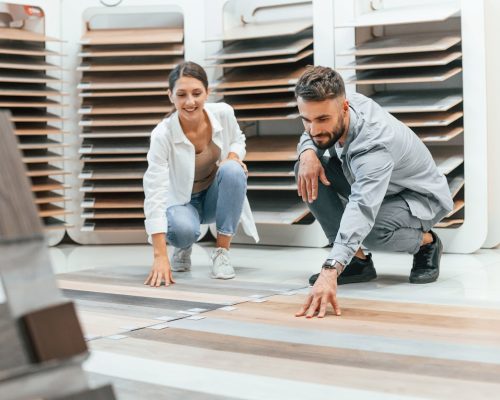 Woman and man is in the store of goods for the home.